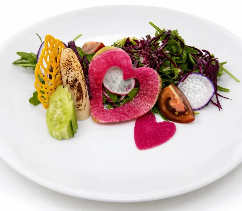 The Heartbeat salad: flame-kissed heart of palm, watermelon radish hearts, golden tuile