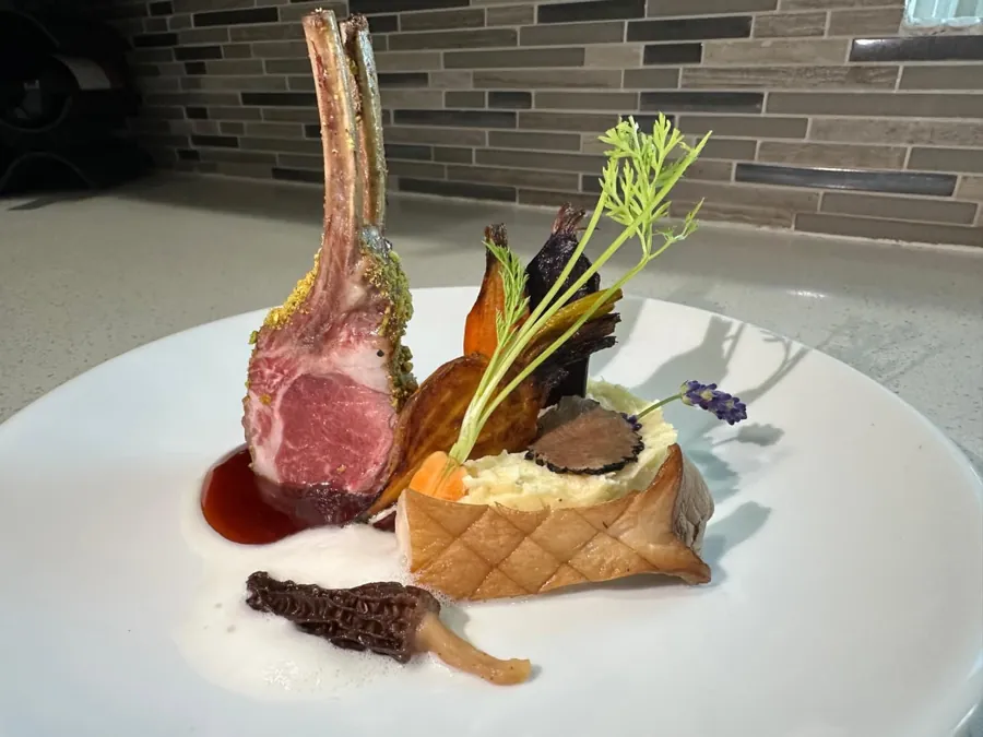 Pistachio-crusted rack of lamb with red wine sauce, truffle king oyster mushroom and roasted heirloom carrots
