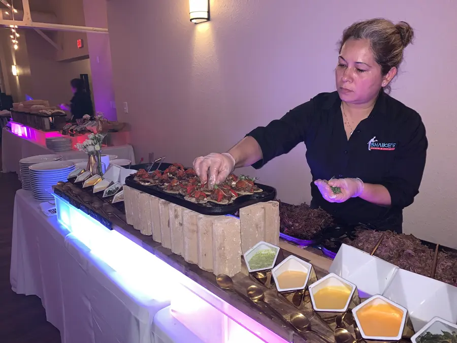 Finishing the tostadas by hand