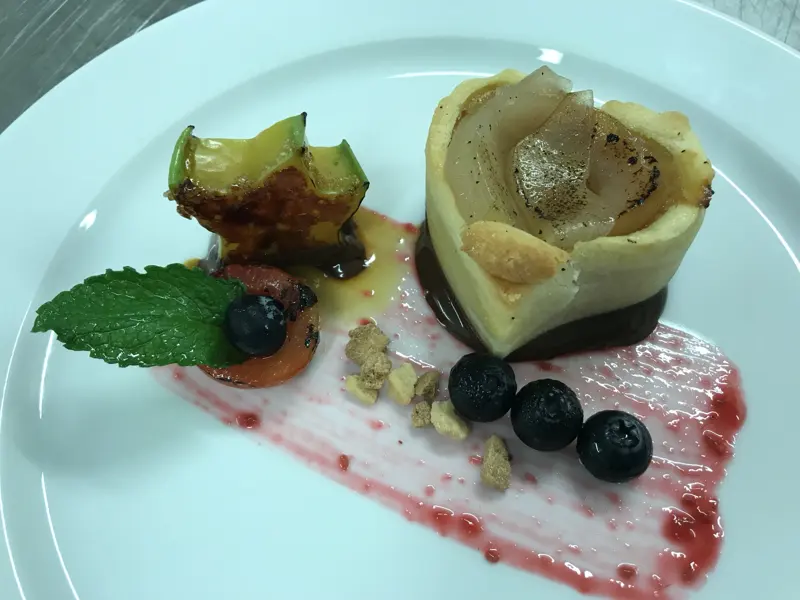 Pear tart with star fruit and berries