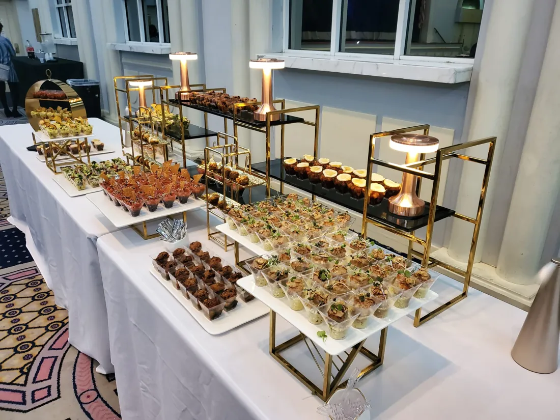 Cold cocktail menu: an array of cold bites in individual cups on gold stands